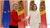 European Commission President Ursula von der Leyen shakes hands with Moldovan President Maia Sandu in Chisinau on November 10.