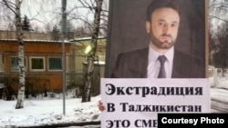 Tajiks protested in December in front of the UAE Embassy in Moscow against the arrest of opposition leader Umarali Quvatov, shown on placard, in Dubai.