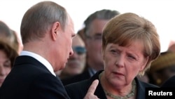 Russian President Vladimir Putin talks with German Chancellor Angela Merkel in June