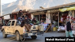 Taliban soldiers drive down a street in Panjshir, the last region of Afghanistan to resist the militants' takeover of the country.