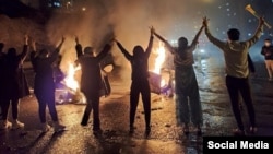 Young Iranians protest against the government in the western city of Sanandaj on November 16. 