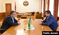 Nagorno-Karabakh leader Arayik Harutiunian (right) meets with Ruben Vardanian in September.