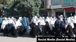 Schoolgirls rally against the closing of their schools in Paktia on September 10.