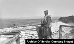 A young Serbian soldier with a medal at a frontline lookout.