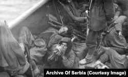 Exhausted Montenegrin fighters being transported across Lake Shkodra after the capture of Skadar in today’s Albania by Balkan League forces.