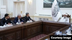 Turkmen Foreign Minister Rashid Meredov (third from left) and his delegation meet with Taliban Prime Minister Mullah Hassan Akhund in Kabul on October 30.