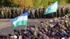 Troops mobilized from Bashkortostan (flying flags of the region) gather at their place of deployment in the Saratov region in October.