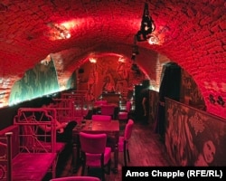 The basement of the Masoch Cafe, where ordering cocktails such as Punish Me, My Mistress! will get customers summoned to strip half-naked and undergo a painful-looking ritual involving whips and hot candle wax.