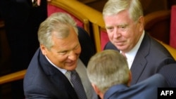 EU envoys Aleksander Kwasniewski (left) and Pat Cox (right) during a visit to Kyiv in September