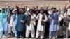 Volunteers of Pen Path led by Matiullah Wesa (holding a megaphone) during a March 25 protest for education for all. 