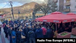 Citizens in Zvecan, Kosovo, sign a petition to remove ethnic Albanian mayors on January 18.