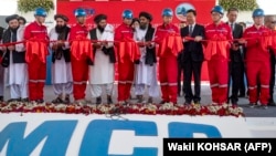 Afghan and Chinese officials attend a ribbon-cutting ceremony to inaugurate the Mes Aynak copper-mining project on July 24.