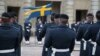 Swedish soldiers take part in the changing-of-the-guard ceremony in the courtyard of the Royal Palace in Stockholm on February 24.