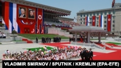 Russian President Vladimir Putin and North Korean leader Kim Jong Un attend an official welcoming ceremony during their meeting in Pyongyang on June 19.