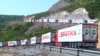 An Armenian convoy of trucks waits near an Azerbaijani checkpoint at the beginning of the Lachin Corridor on July 27. 