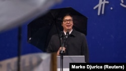 Serbian President Aleksandar Vucic addresses his supporters during a rally in front of the parliament building in Belgrade on May 26.