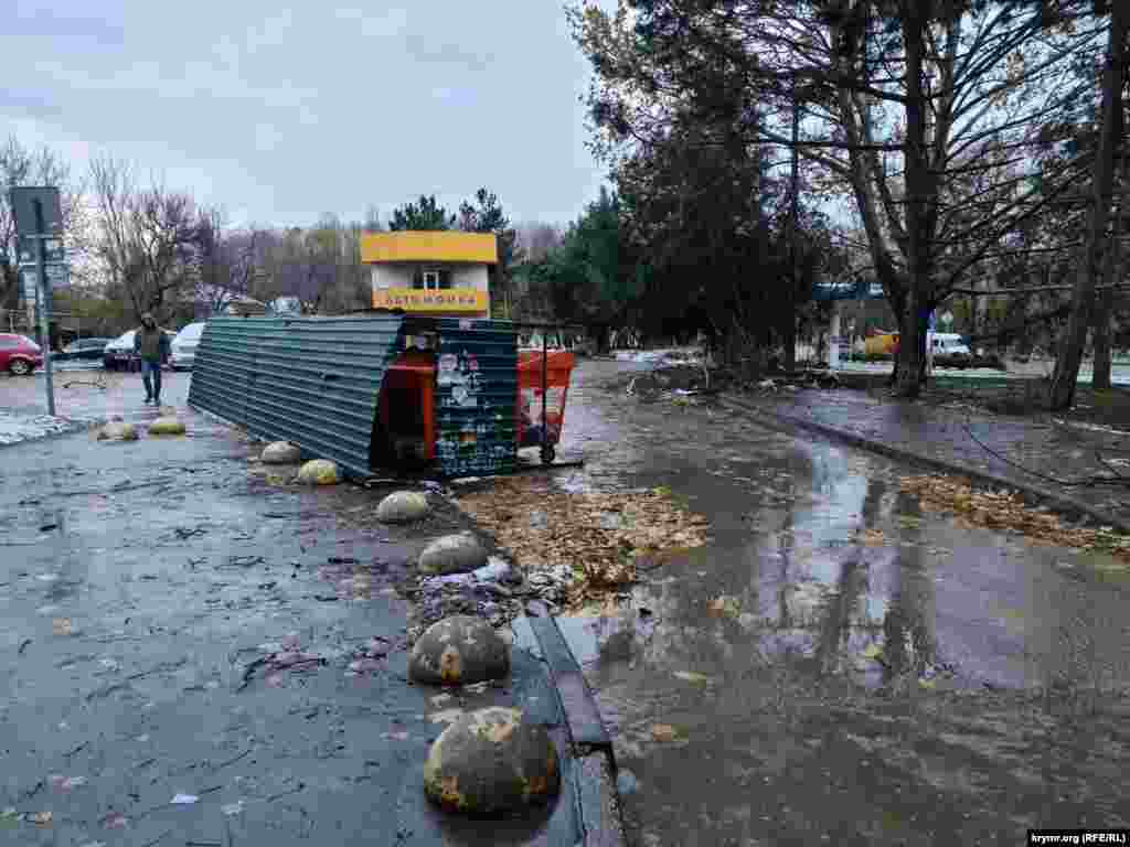 A resident walks amid the aftermath of flooding in Crimea&#39;s capital, Simferopol, on November 27.