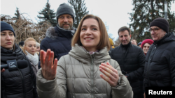 Moldovan President Maia Sandu attends a rally and concert in Chisinau celebrating the European Union's decision to open membership talks with Moldova earlier this month. 