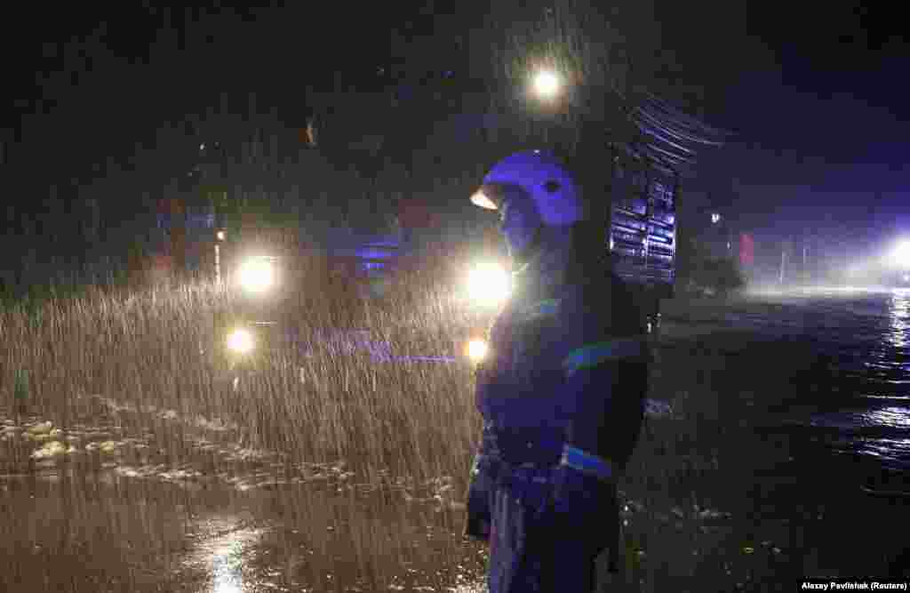 Rescuers take part in an emergency evacuation of local residents in Yevpatoria during the heavy rains. &quot;There is one fatality, according to preliminary information. It happened in the village of Morske, near Sudak. A man went to watch the waves and, unfortunately, died a tragic death,&quot; Kryuchkov said in a live program on the Russian state-run TV channel Rossia-24.