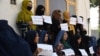 Afghan women hold a protest to demand their right to education and employment in Mazar-e-Sharif earlier this year. 