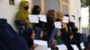 Afghan women protest for their right to education and work in Mazar-e-Sharif on August 16.