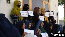 Afghan women protest for their right to education and work in Mazar-e-Sharif on August 16.