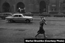 A woman crosses October Square, Minsk, 1988.