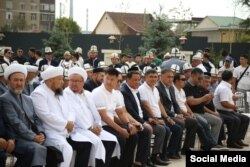 Raimbek Matraimov (front-row center, in dark jacket) and members of parliament at the August 27 opening of the Muftiate building in Bishkek.