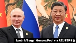 Russian President Vladimir Putin and Chinese President Xi Jinping (composite file photo)