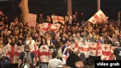 Protests in Tbilisi on May 28 after parliament voted to reject the president's veto of a controversial "foreign agent" bill.