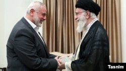 Hamas political leader Ismail Haniyeh (left) with Iranian Supreme Leader Khamenei