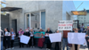 Relatives of some of those arrested for protesting a border deal with Uzbekistan rally in the Kyrgyz capital of Bishkek on April 24, 2024.