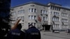 Police monitor a school in Burgas, Bulgaria, that received a bomb threat on March 27.