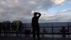 A Japanese soldier stands on the flight deck of a Japanese amphibious transport ship in waters close to Okinawa, Japan, on November 15. 