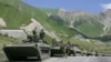 A convoy of Russian troops makes its way through the mountains toward the conflict between Georgian troops and separatist South Ossetian troops on August 9, 2008. 