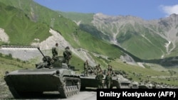 A convoy of Russian troops makes its way through the mountains toward the conflict between Georgian troops and separatist South Ossetian troops on August 9, 2008. 