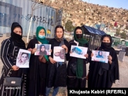 Members of the Afghan Women's Empowerment Movement gather at Sadat's grave in Kabul.