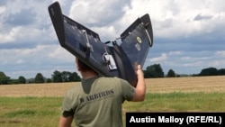 A Warbirds Of Ukraine worker tests a new Galka UAV at an airfield on the outskirts of Kyiv.