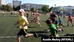 Vinnytsya Wolves youth players run sprints during one of the club's morning practices.