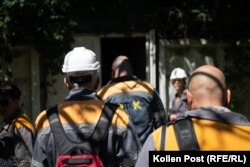 As another air-raid alarm sounds, DTEK employees file into an underground shelter.