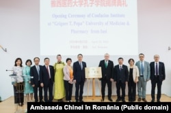 A group photo published after the inauguration of the Confucius Institute at UMF Iasi. In the picture, Ambassador Han Chunlin (middle left) stands next to Viorel Scripcaru, the university’s rector, as well as other teaching staff.