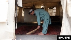 A man cleans an empty educational facility set up by UNICEF after it was closed on April 16 on the orders of the Taliban government in Kandahar, Afghanistan.