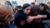 Women hug each other during a march for gender equality and against violence toward women, on International Women's Day, in Sofia, on March 8, 2019.