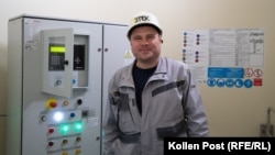 Maksim Bohadytsya stands inside of one of the 19 operational wind turbines.