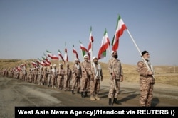 Members of the Islamic Revolutionary Guards Corps take part in a military drill in Iran's East Azerbaijan Province in October 2022.