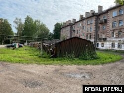 Brick apartment blocks for officers and broken-down sheds that once apparently served as garages.