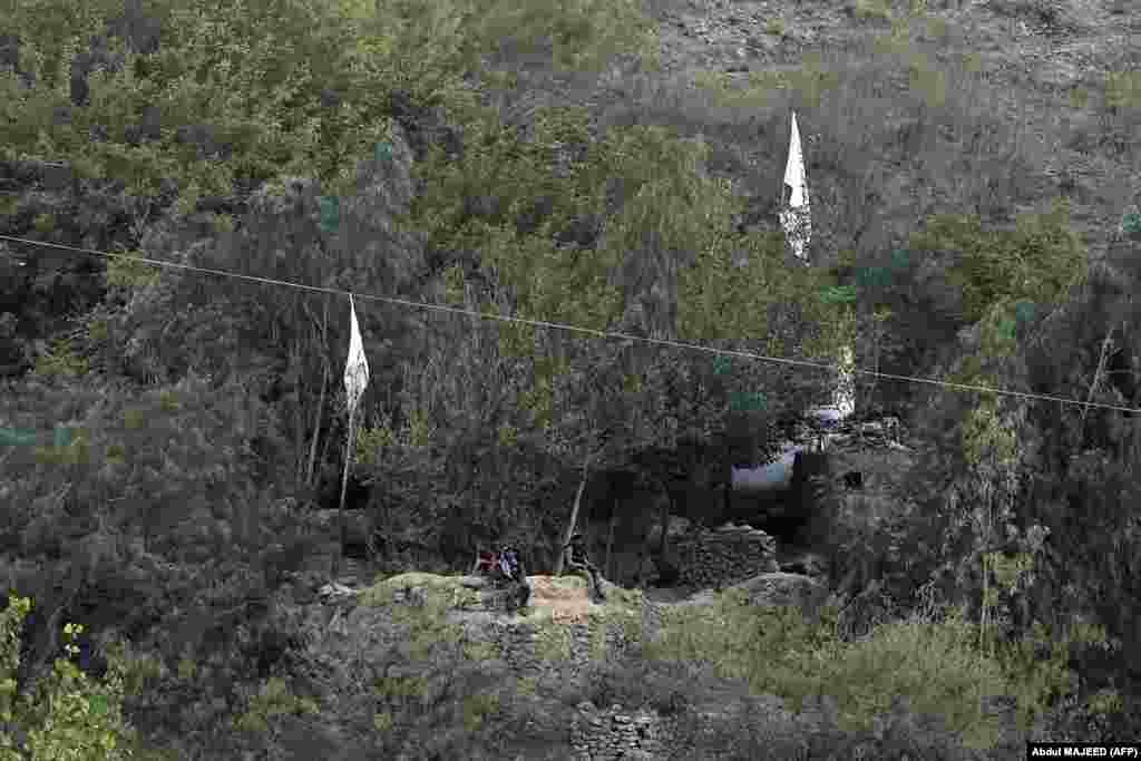 Taliban security personnel keep watch at a post near Torkham on September 11. The Taliban disputes the demarcation, while Islamabad says it inherited the international border after gaining independence from Britain in 1947.