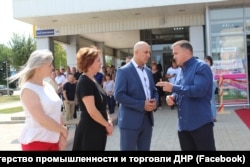 In 2019, together with the industry minister and social policy minister of the Russian-back separatist group DNR, Halchuk (right) solemnly opened the second Galaktika hypermarket in Donetsk.