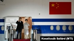 Chinese President Xi Jinping and his wife, Peng Liyuan, arrive in Budapest on May 8. 