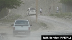 A road in Shing, near Zarafshon. Heavy vehicles working at the mine regularly drive on this road and cause damage that is not repaired.